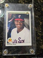 Front of Sammy Sosa 1990 Upper Deck rookie card in acrylic holder