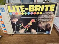 Front of original Lite-Brite box showing branding and artwork