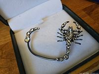 ear cuff in box showing rhinestone details