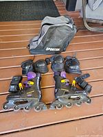 Full lot showing both skates, pads, and carry bag