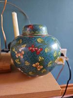Front view of cloisonné ginger jar with lid