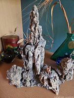 Full view of rock grotto diorama showing overall structure and height