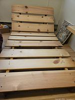 Pine slatted frame reclined, showing softwood slats and knots