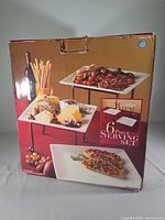 Front of retail box showing plates on stands