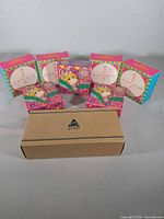 Front view of Avon cardboard box with additional background boxes