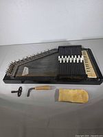 Full autoharp with accessories laid out