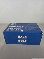 Blue Halo Bolt ACDC Portable Starter box front view shows product branding and corner wear