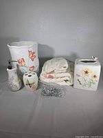 Full lot view showing all ceramic pieces, towels and hardware bag