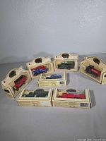 Group shot of seven boxed Lledo models