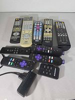 Group shot of all remotes and streaming stick