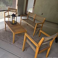 full patio set showing two chairs, loveseat and coffee table