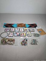 All lot items together: beaded belt, DeGrazia magnets, metal bangle and multiple bags of beads/charms