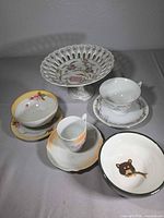Group view of all porcelain pieces on tabletop