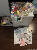 Organizer with drawers, sticker sheets on top and in front