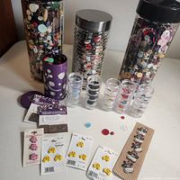 Overall lot showing three jars, stack organisers, tin, button cards and loose buttons