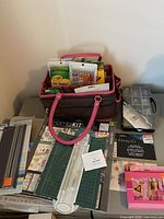 Overall lot on table with tote, trimmers, mambi kit, colored pencils etc