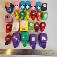 All 25 punches laid out beside 12-in. ruler