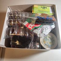 Open box showing multiple small jars and confetti packs