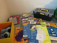 Overall view of templates, toolbox, labelers and mat on table