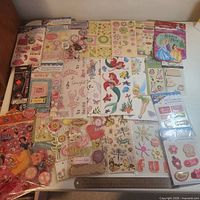 All 25 sticker packs laid out on tabletop