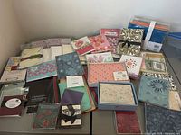 Overview of all packaged card sets spread on table