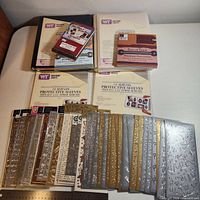 Entire lot showing sticker sheets, two albums, two sleeve packs