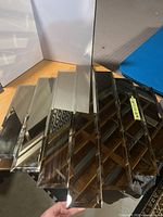 Five beveled mirror panels arranged as single mirror, alternating tints