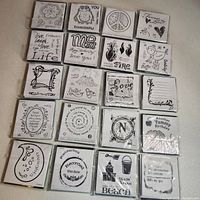 All twenty sealed Inkadinkado cling stamp sets arranged five by four