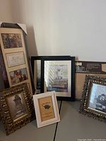 Group of assorted frames showing sizes, colors, collage frame and storage box