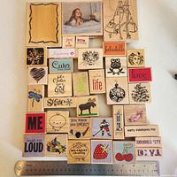 All 36 rubber stamps arranged with ruler for scale
