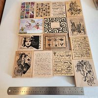 All 14 wood-mounted rubber stamps with ruler for scale