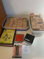 Overview of stamps in two plastic tubs, 4-in-1 StampKit, Making Memories kit, Ranger item