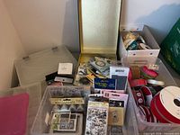 Overview of stamps, storage boxes, ribbon spools and ink pads
