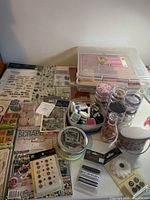 Overview of lot showing stamps, ink pads, plastic paper cases, embellishment jars