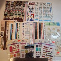 All 27 sealed sticker packs displayed