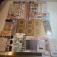 Full lot layout showing all 28 sticker packs spread across table