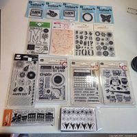 All fifteen packages of clear cling stamps laid out on tabletop