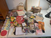 Wide view of entire lot showing wooden items, crayons, stickers, shaker boxes and accessories