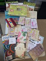 Full lot overview on tray showing scrapbook album, magazines, journals, notepads, sticky notes