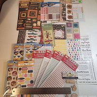 All sticker packs laid out with ruler for scale