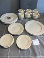 Overall lot showing mugs, various plate stacks