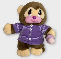 Front view of plush monkey showing shirt and ice cream cone