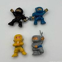 Front view of all four ninja figures showing colors and poses