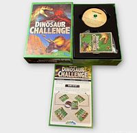 Open box showing cover art, rulebook, challenge disk, card deck