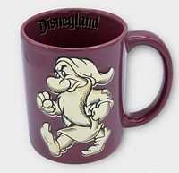Profile of mug showing raised Grumpy character graphic