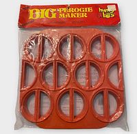 front view of sealed Big Perogie Maker in packaging