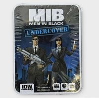Front of sealed Men in Black Undercover card game tin
