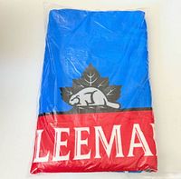Front of sealed Sleeman beach towel showing logo and colours