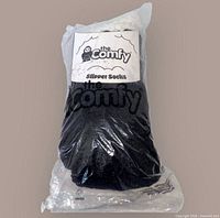 sealed plastic bag showing The Comfy slipper socks label