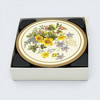 Top view showing floral design coaster in box